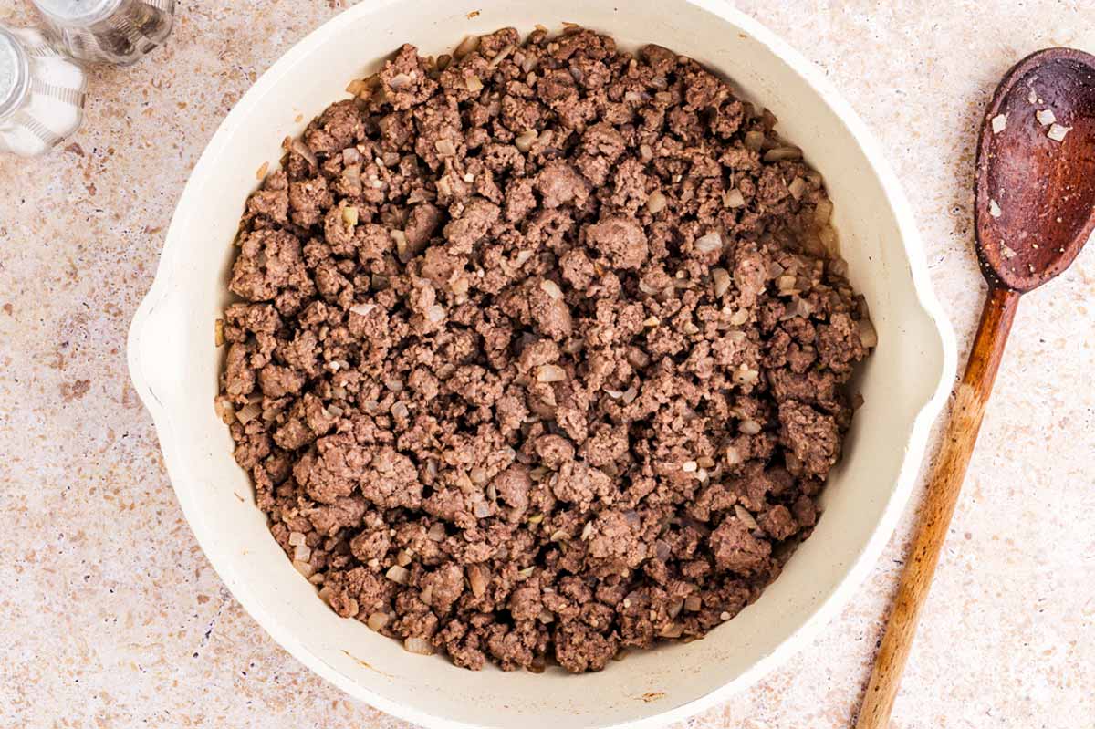 Browned ground beef in skillet.