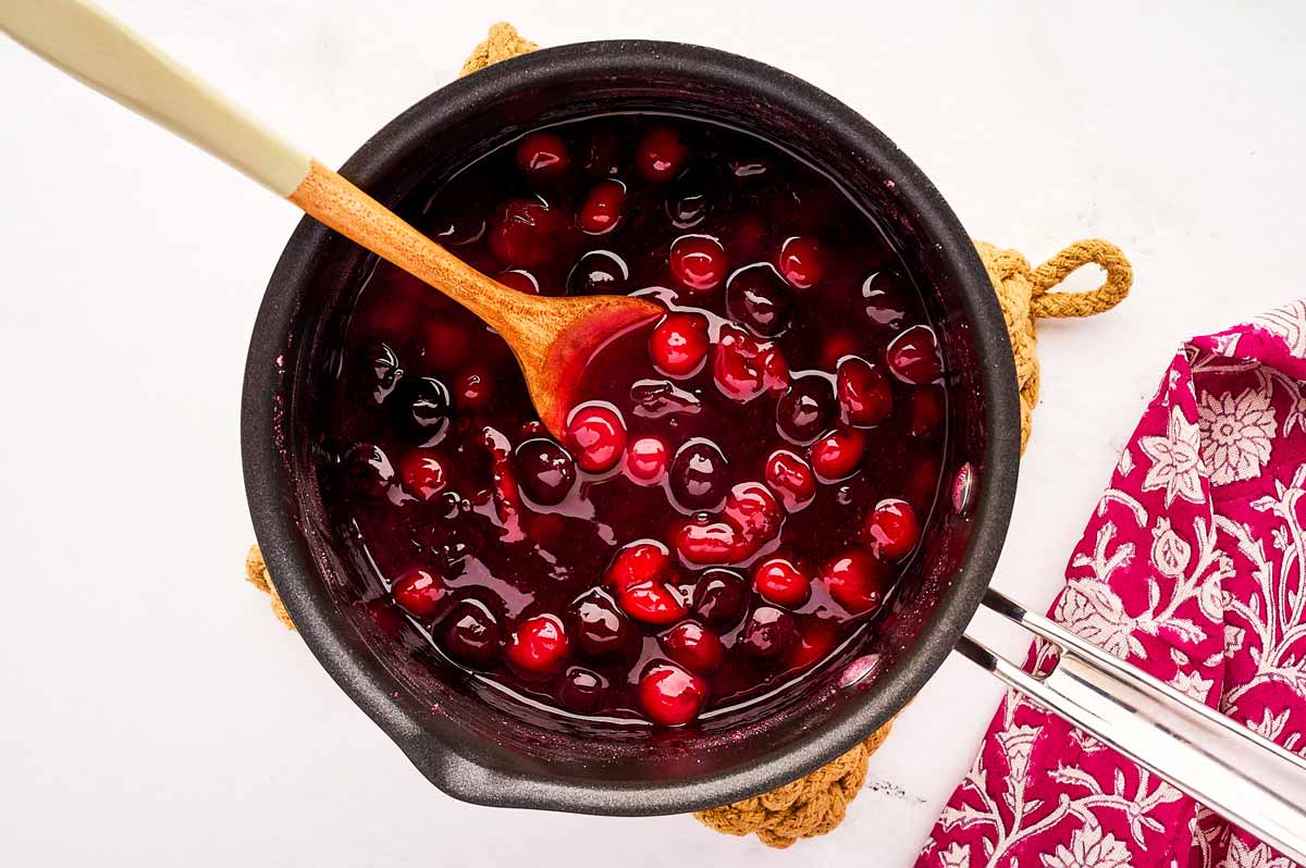 Cherry pie filling in a saucepan.