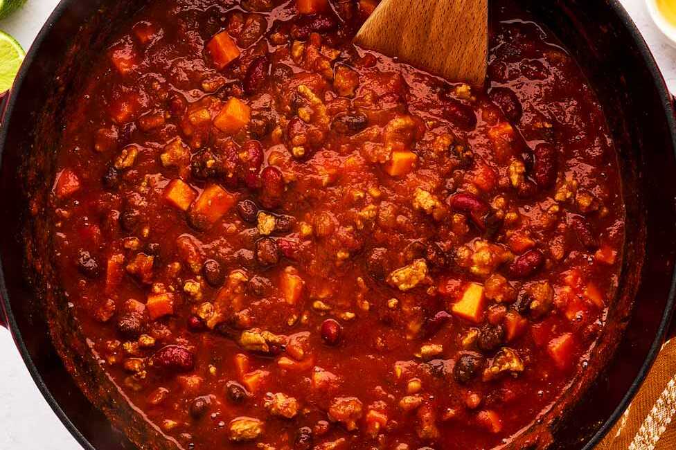 Simmering turkey chili in a Dutch oven.