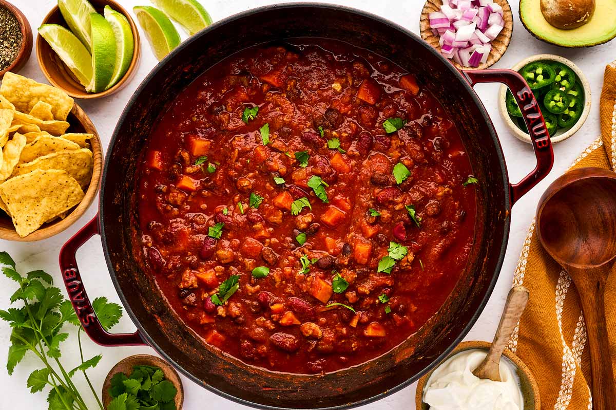 Serving turkey chili with toppings.