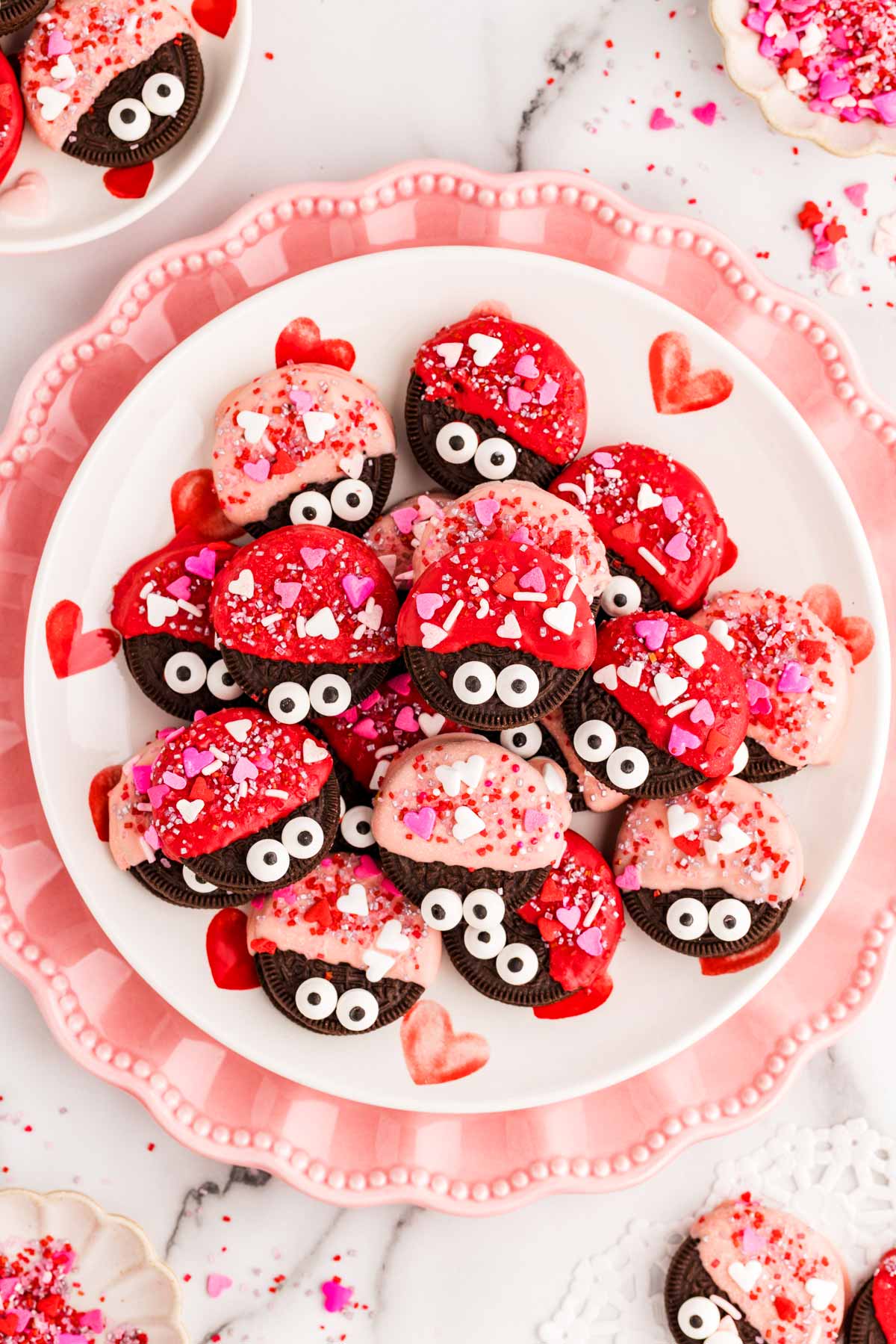 Love bug decorated Oreos on a plate.