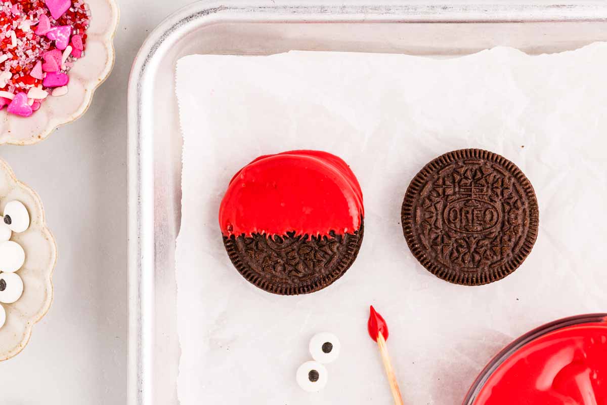 Dipping oreo cookies.