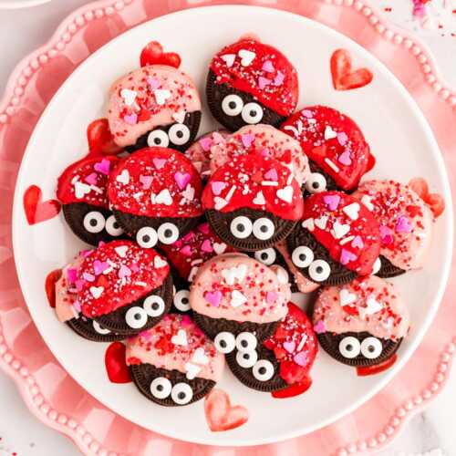 Love bug decorated Oreos on a plate.