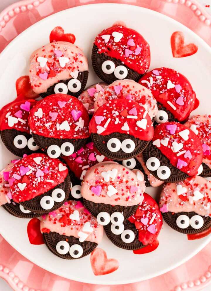 Love bug decorated Oreos on a plate.