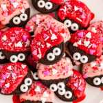 Love bug decorated Oreos on a plate.