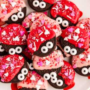 Love bug decorated Oreos on a plate.