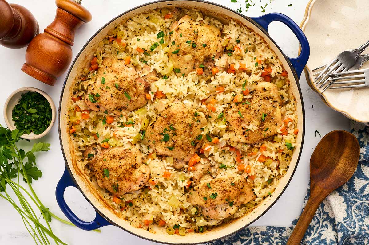 Pan with baked chicken thighs and rice.