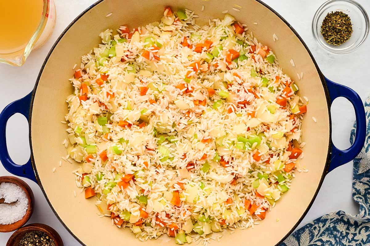 Sautéing mirepoix and rice.