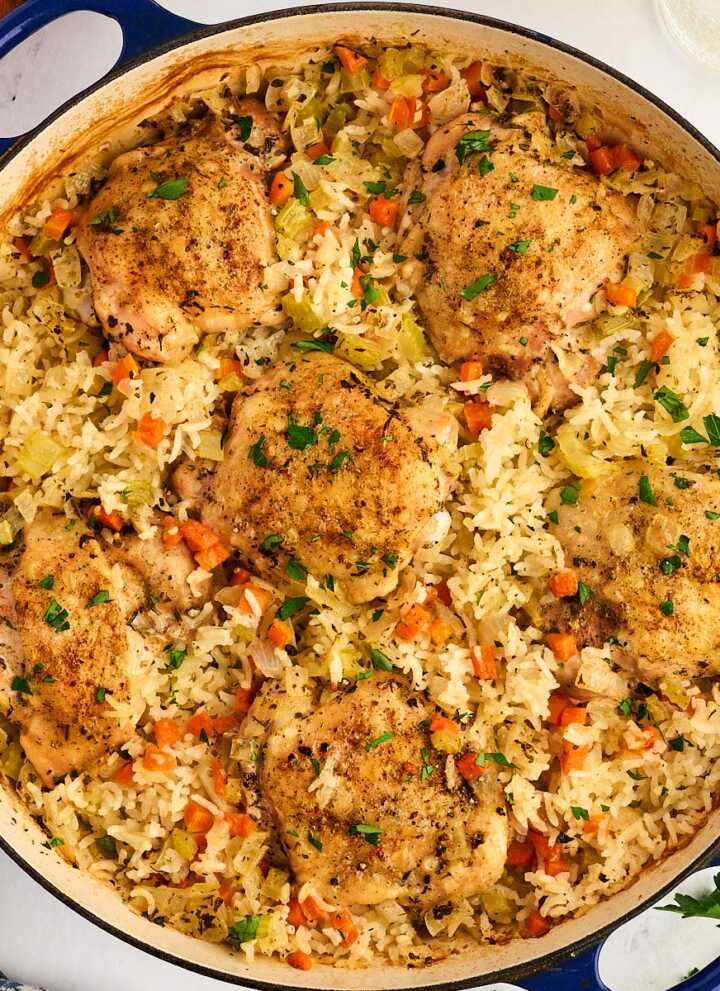 Pan with baked chicken thighs and rice.