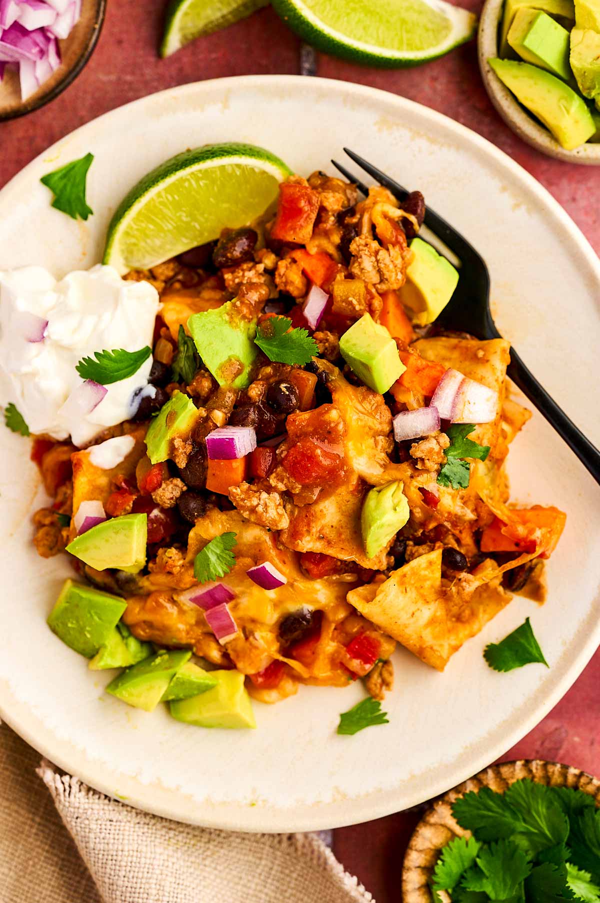Serving a plate of enchilada casserole.