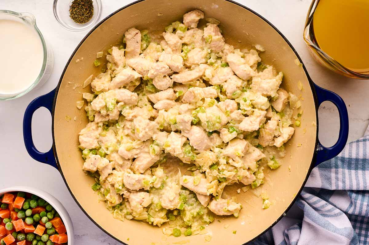 Roux and chicken in a braiser.