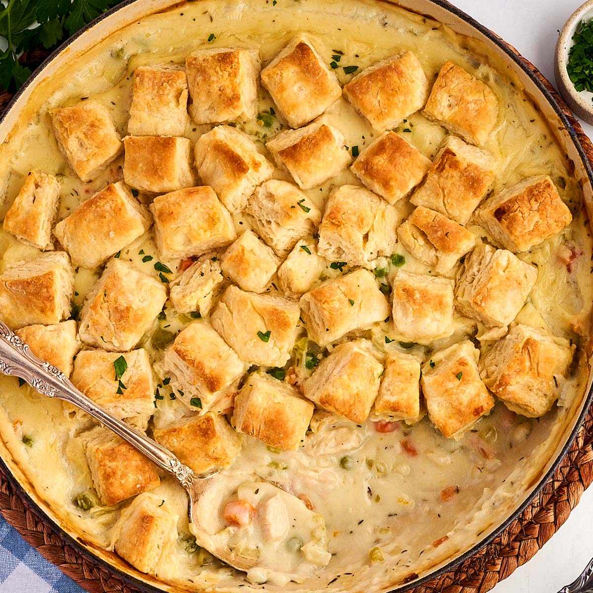 Serving chicken and biscuits from the pan.