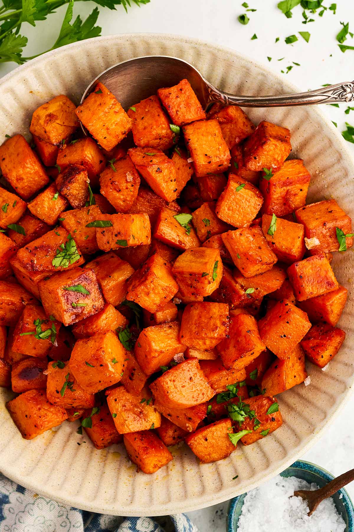 Bowl with roasted sweet potato cubes.