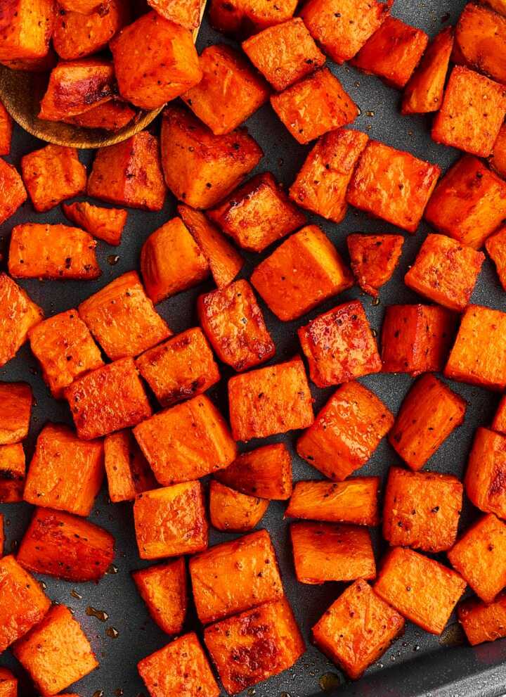 Pan with roasted sweet potato cubes.