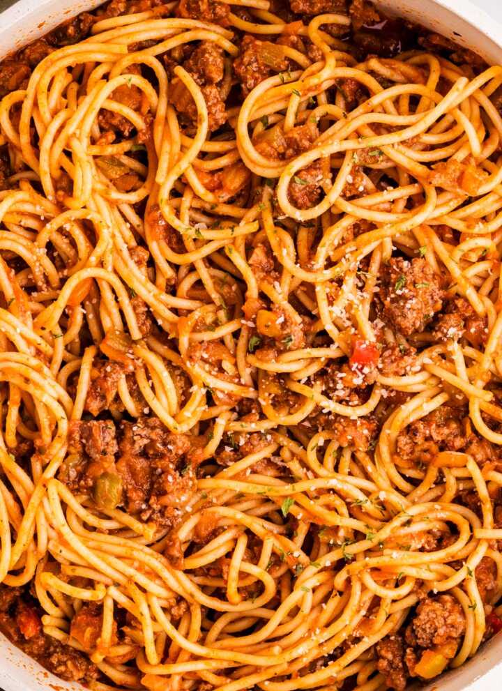 Skillet with spaghetti and meat sauce.