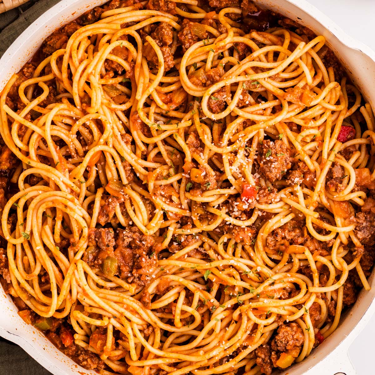 Skillet with spaghetti and meat sauce.