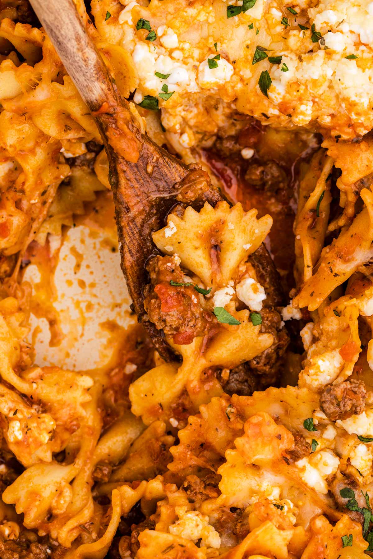 Scooping up bowtie lasagna.