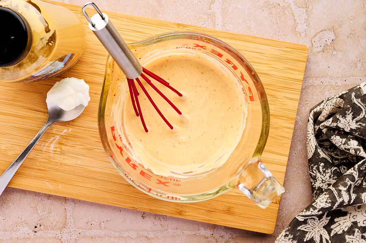 Making dipping sauce in a glass measuring cup.