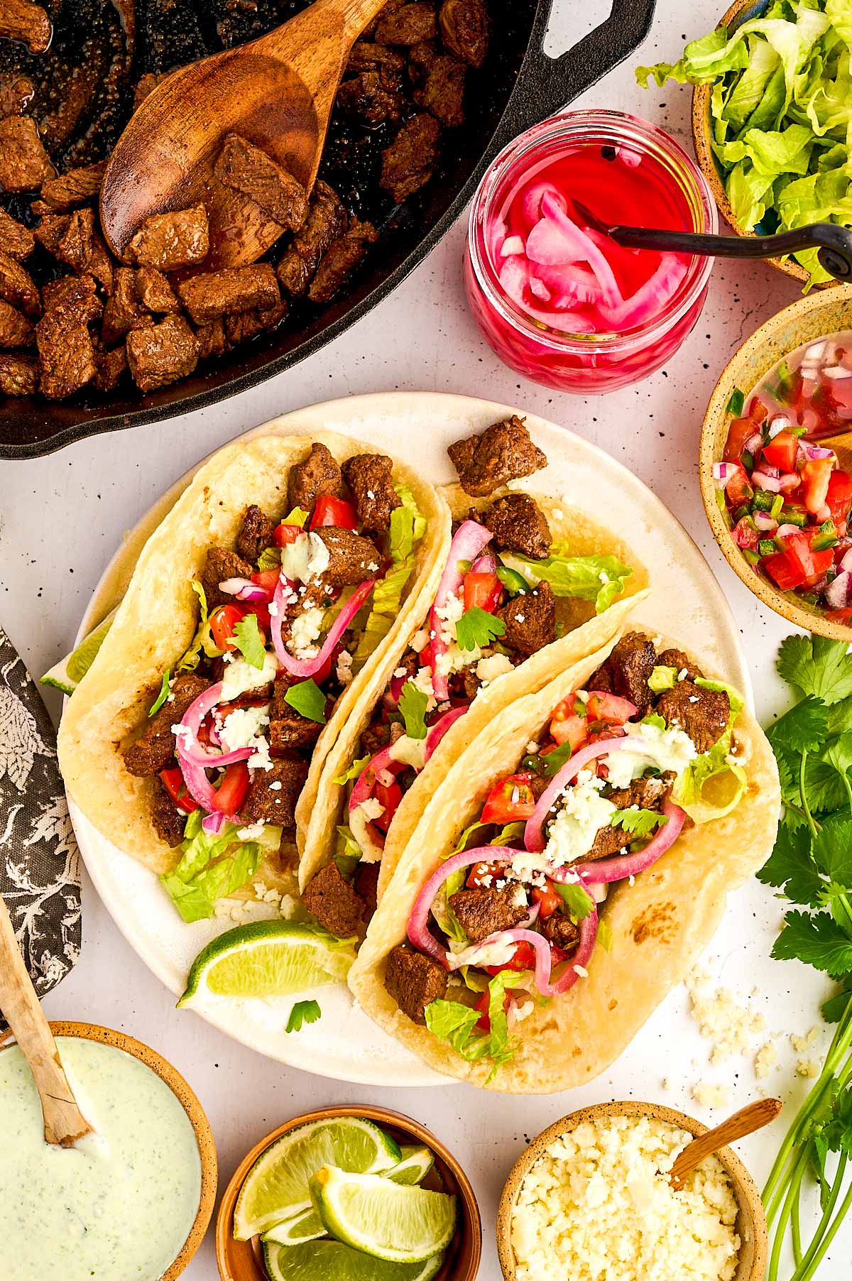 Serving steak tacos with all the fixings.