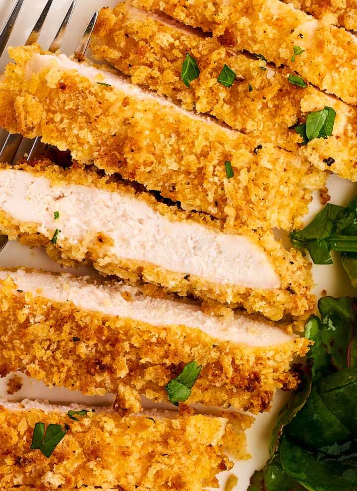 Sliced Chicken cutlet with salad.