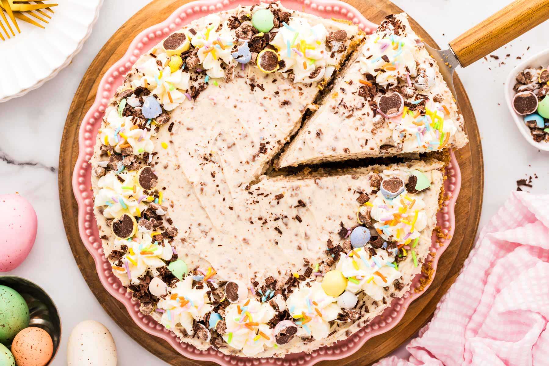 Mini Egg Easter Cheesecake with a slice cut.