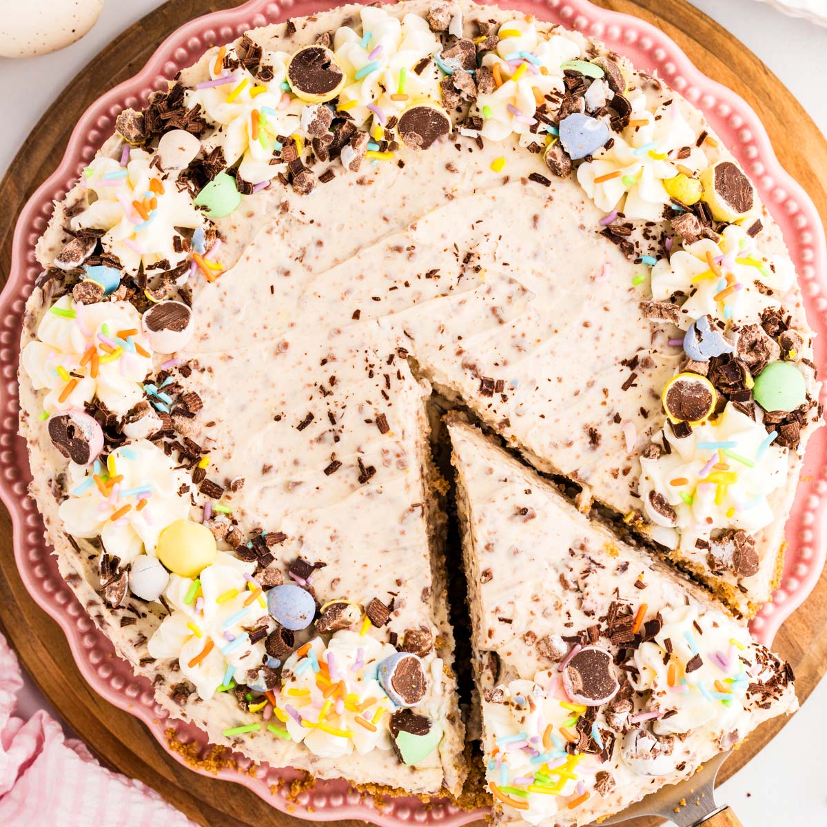 Mini Egg Easter Cheesecake with a slice cut.