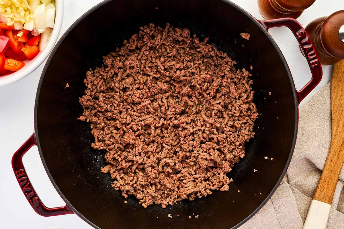 Browned ground beef in pot.