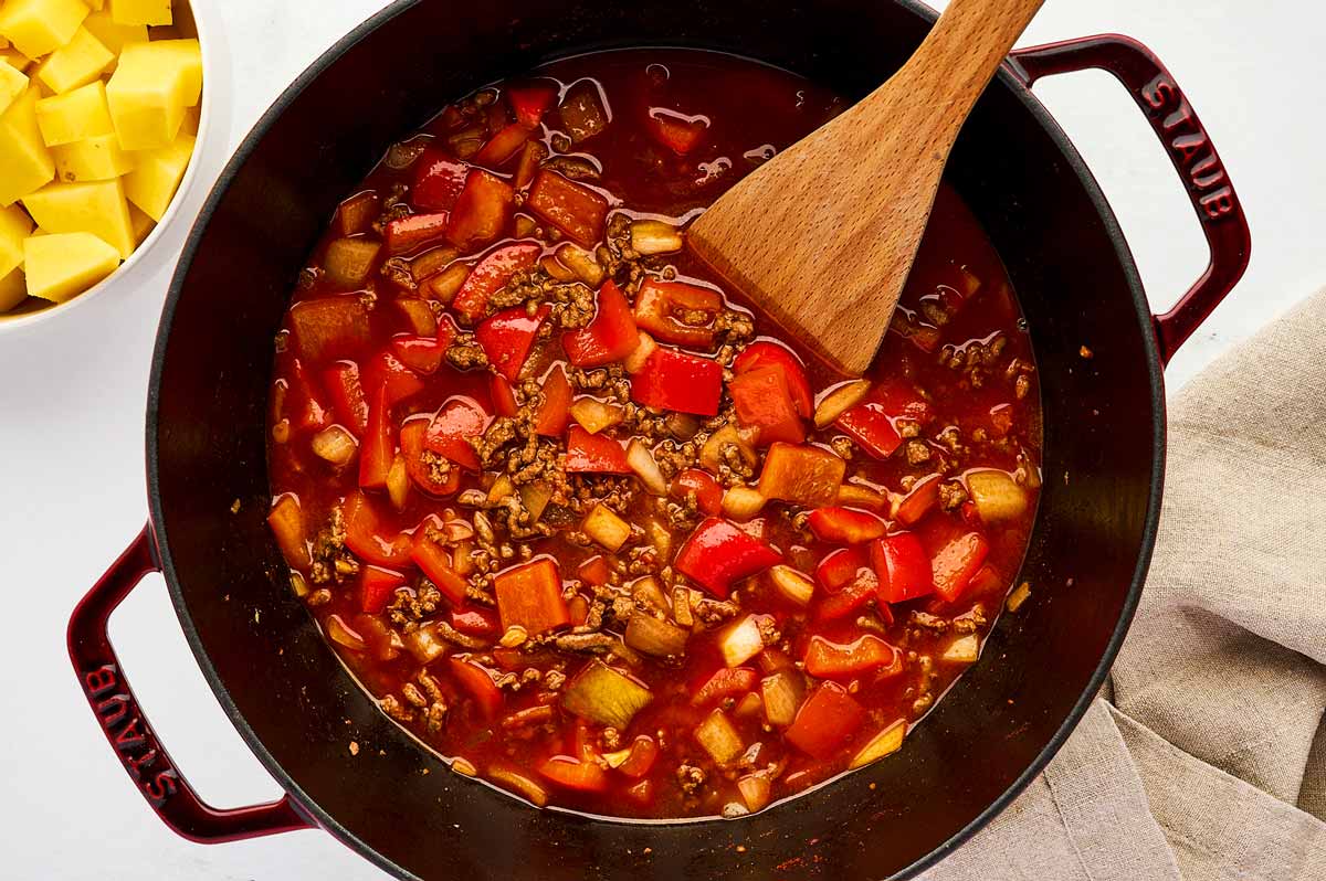 Uncooked ground beef and potatoes.
