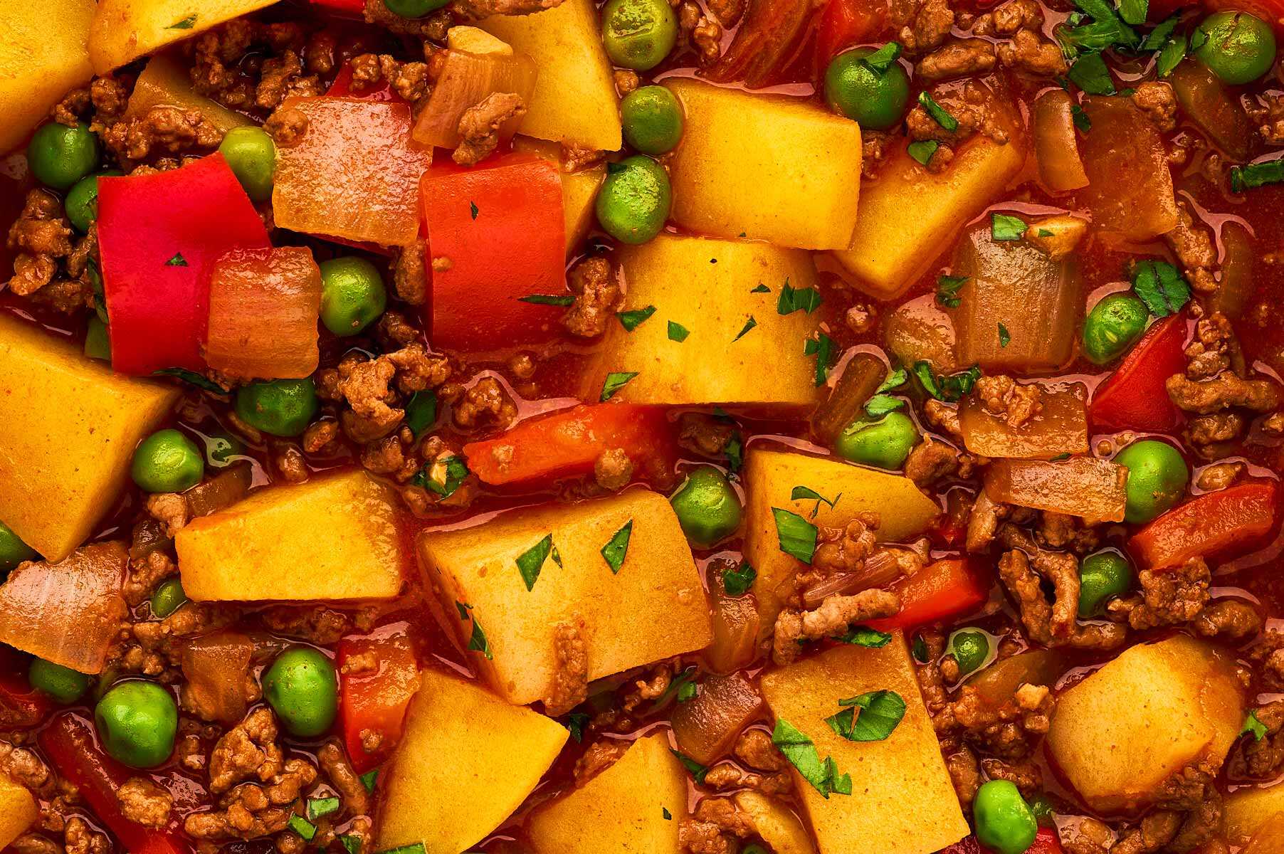 Close up view of ground beef and potato stew.