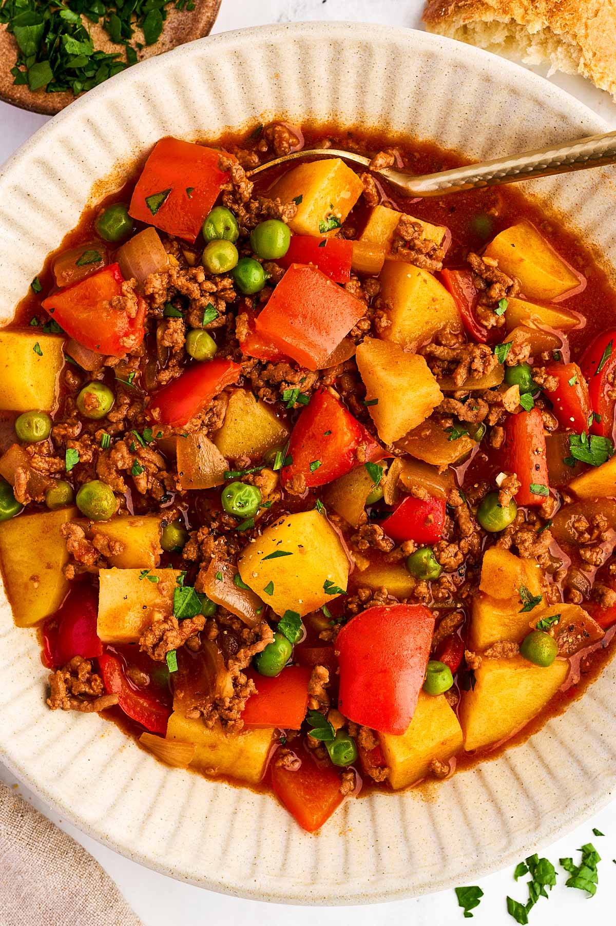 Plate filled with ground beef and potatoes.