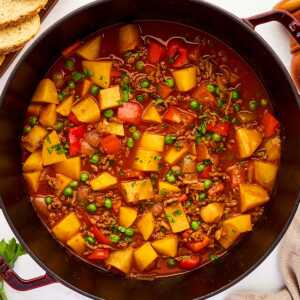 Pot with ground beef and potatoes stew.