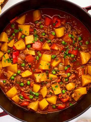 Pot with ground beef and potatoes stew.