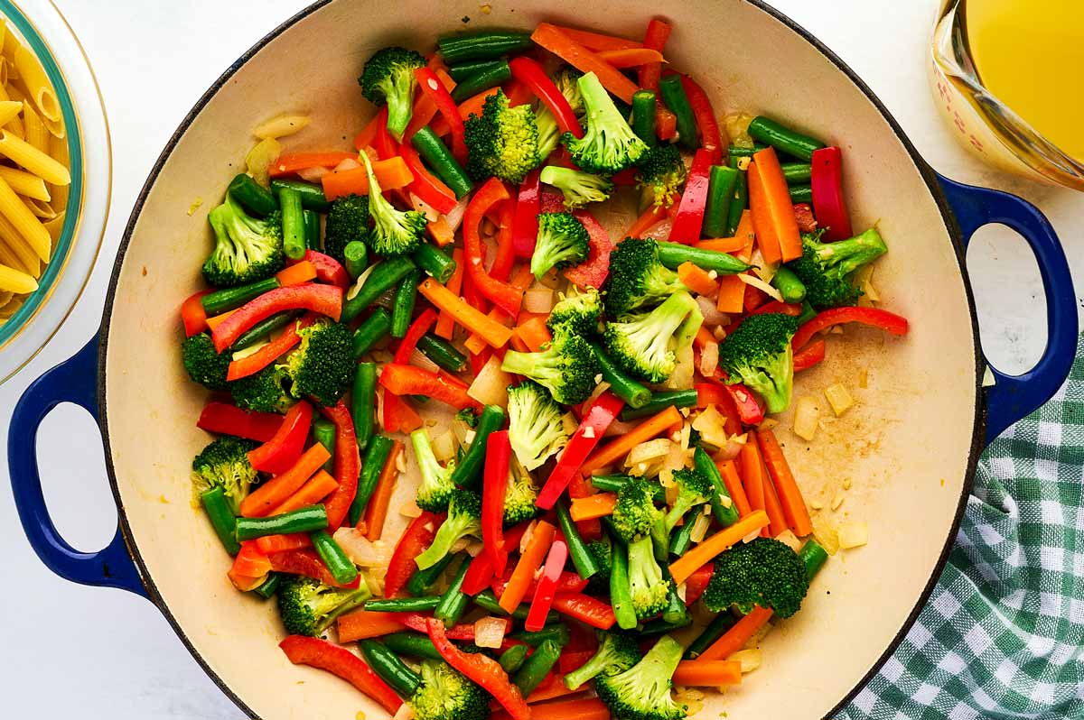 Sautéed vegetables in a pan.