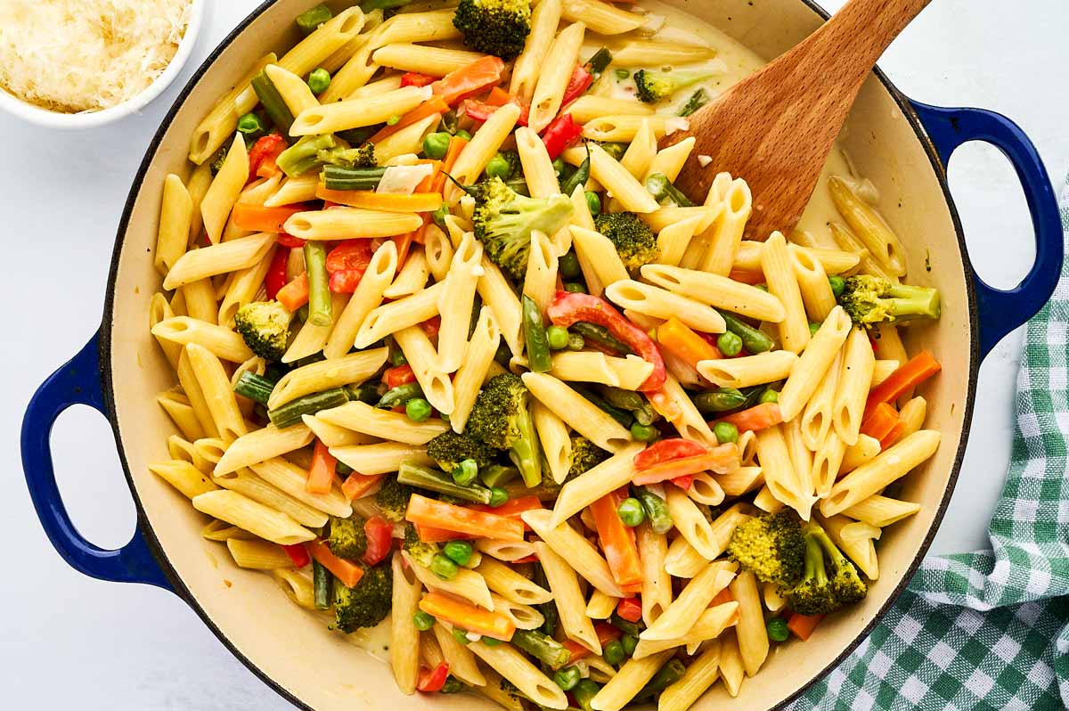 Serving pasta primavera.