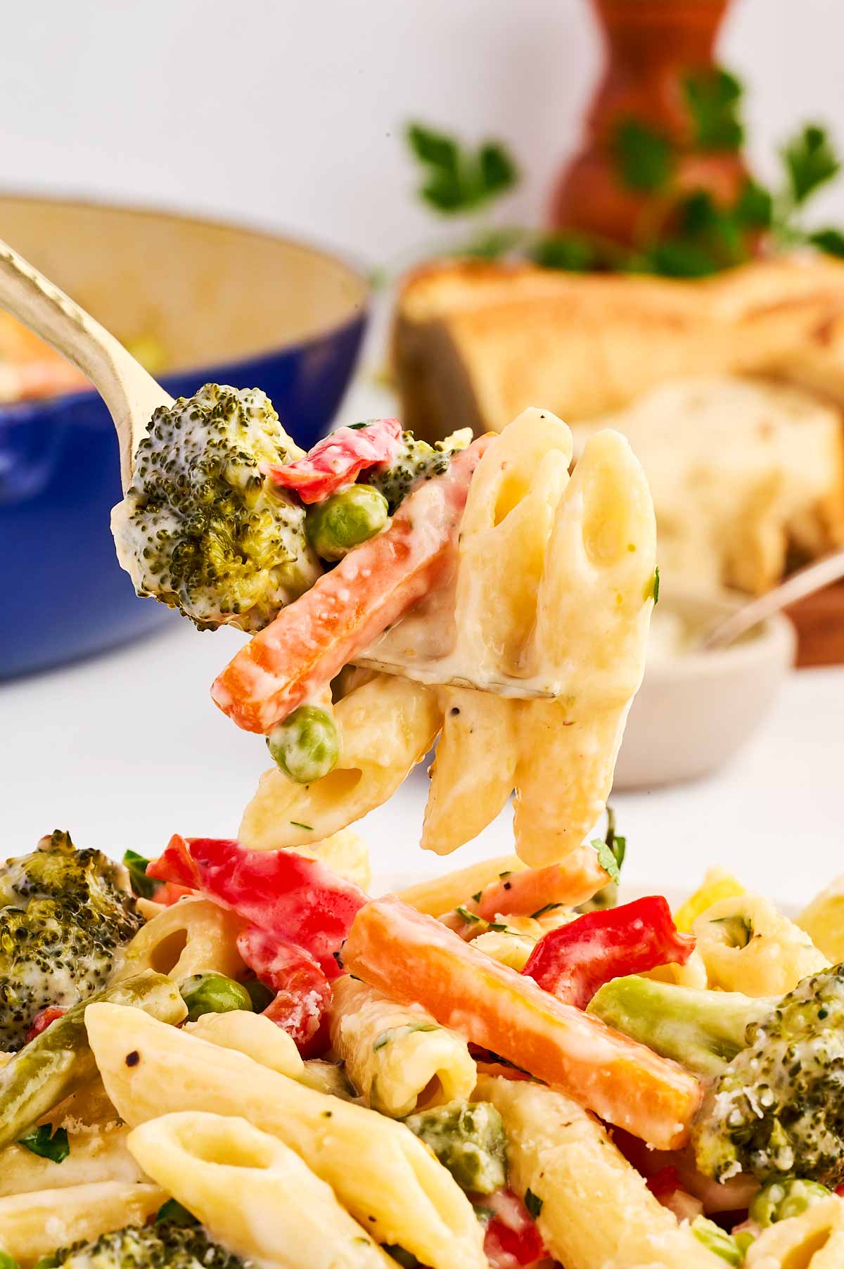 Pasta Primavera on a fork.