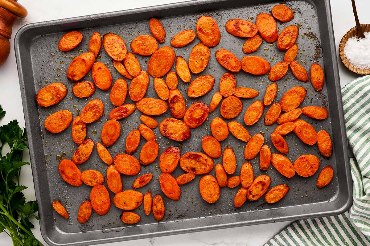 Roasted carrots on a sheet pan.