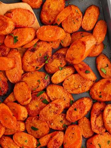 Sheet pan with roasted carrots.
