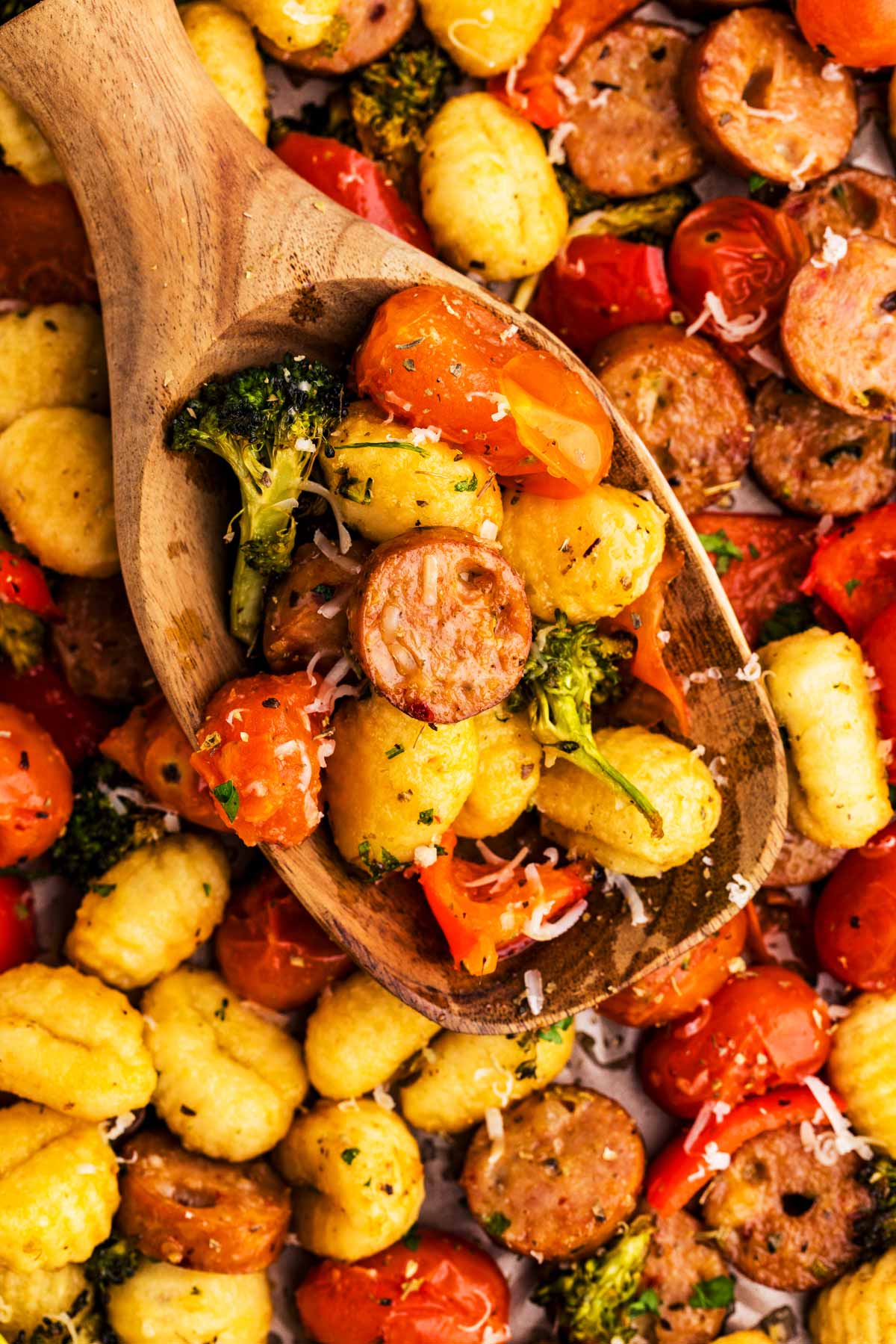 Wooden spoon with sheet pan gnocchi.