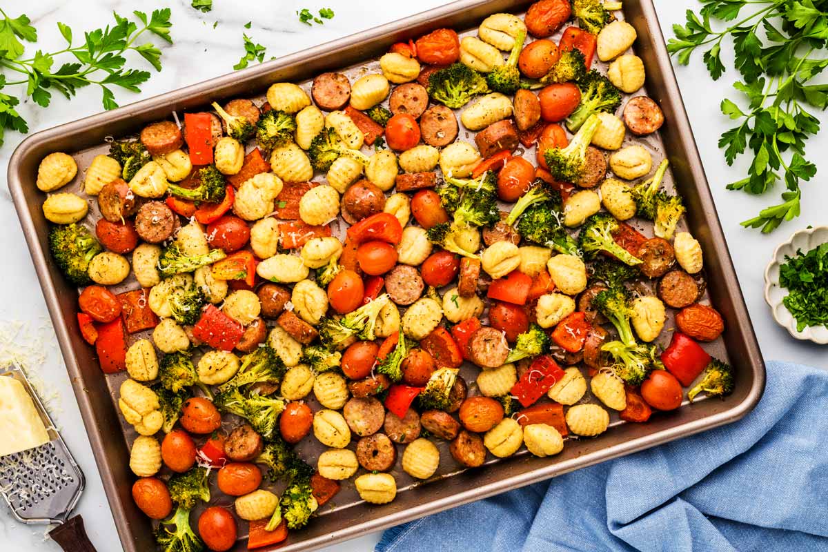 Sheet pan with roasted gnocchi, vegetables and sausage.