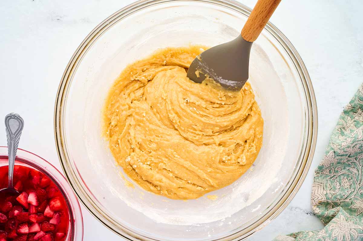 Batter for strawberry bread in glass bowl before adding the strawberries.
