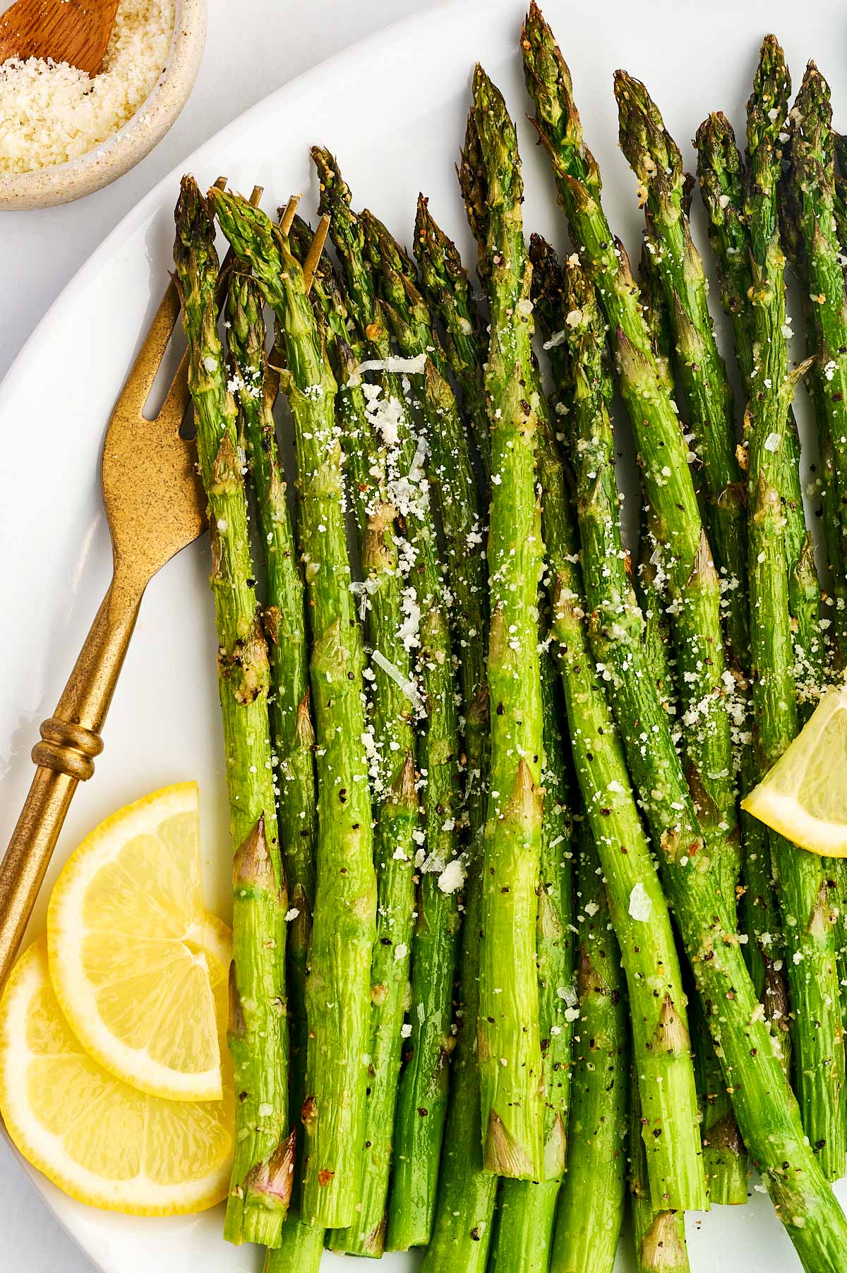 Close up photo of air fryer asparagus on a platter.
