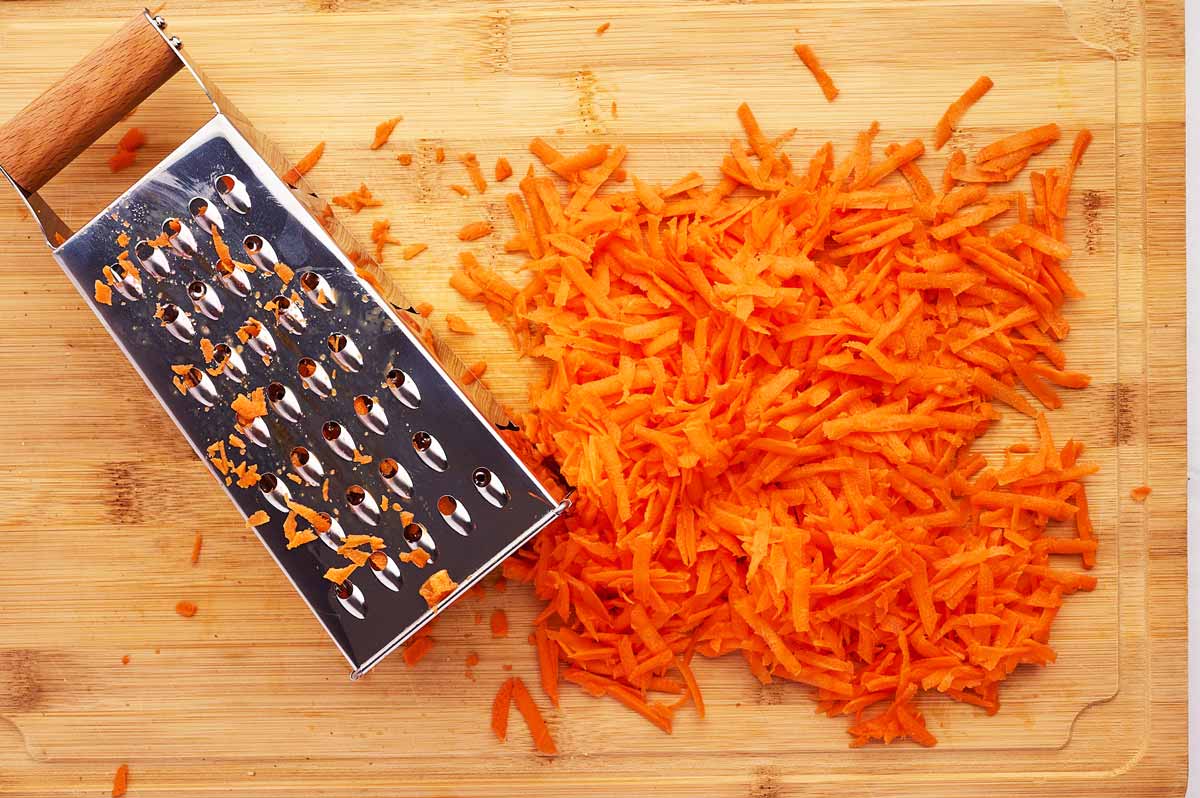 Carrots grated on a box grater.