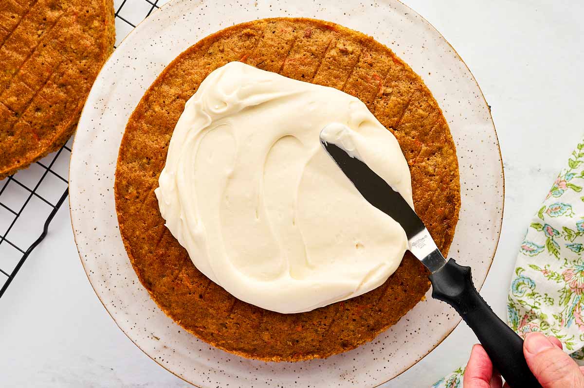 Frosting carrot cake.