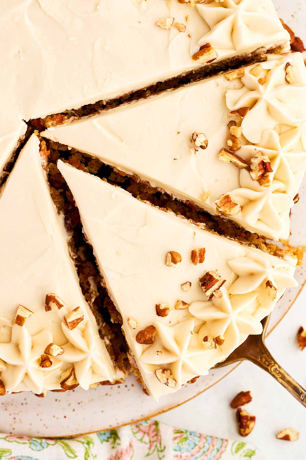 Overhead view of sliced carrot cake.
