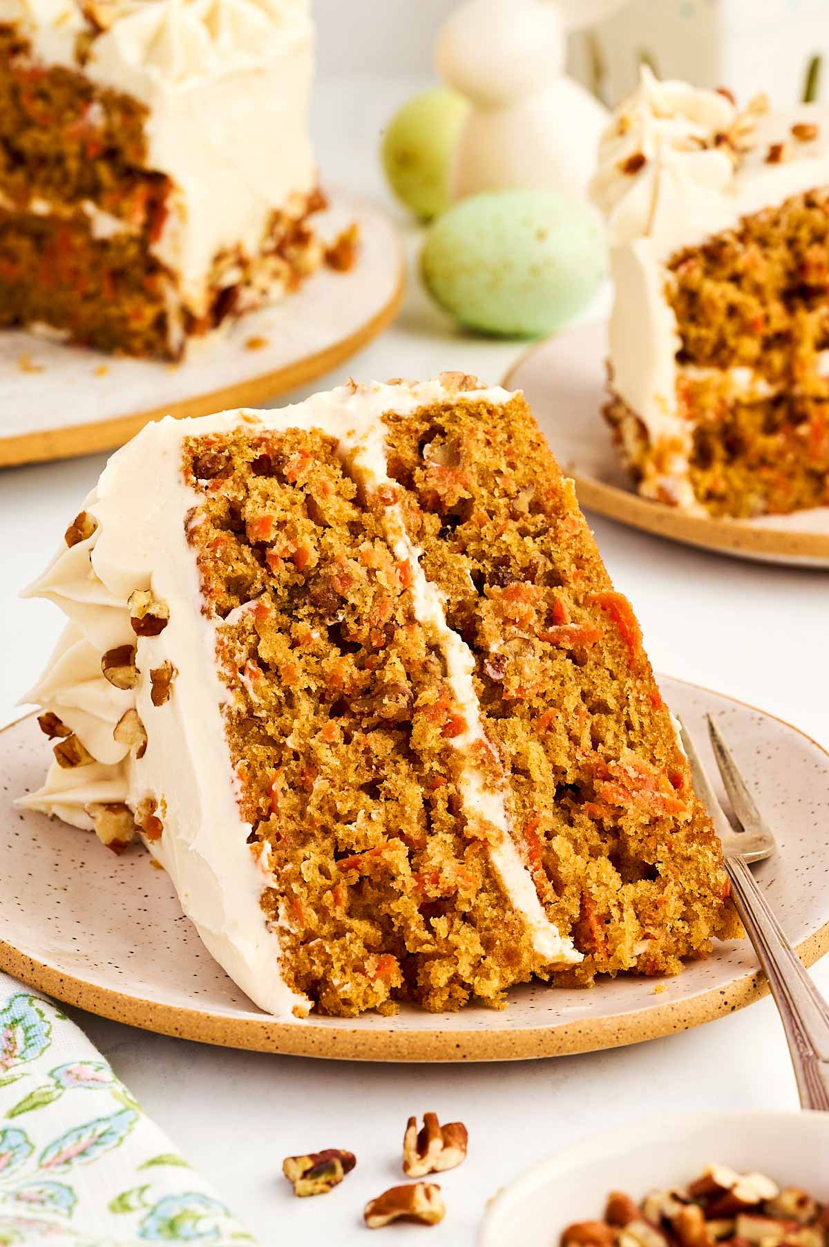 Slice of carrot cake on a plate.
