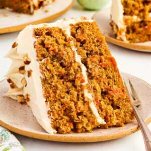 Slice of carrot cake on a plate.