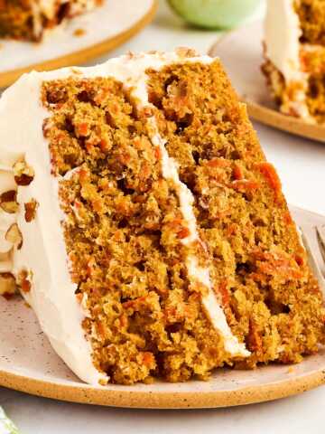 Slice of carrot cake on a plate.