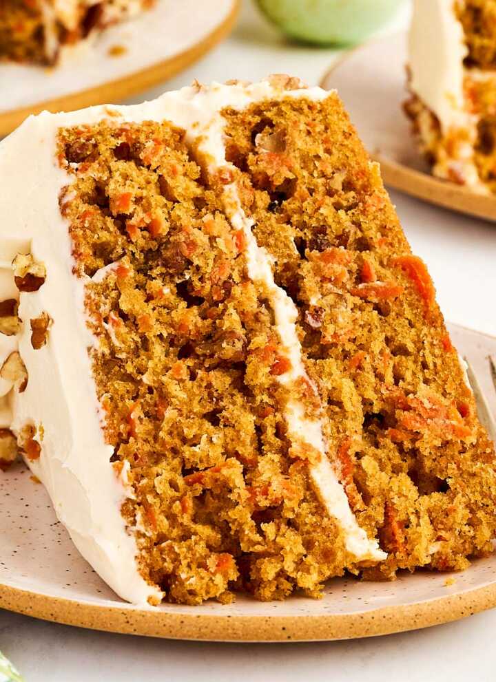 Slice of carrot cake on a plate.