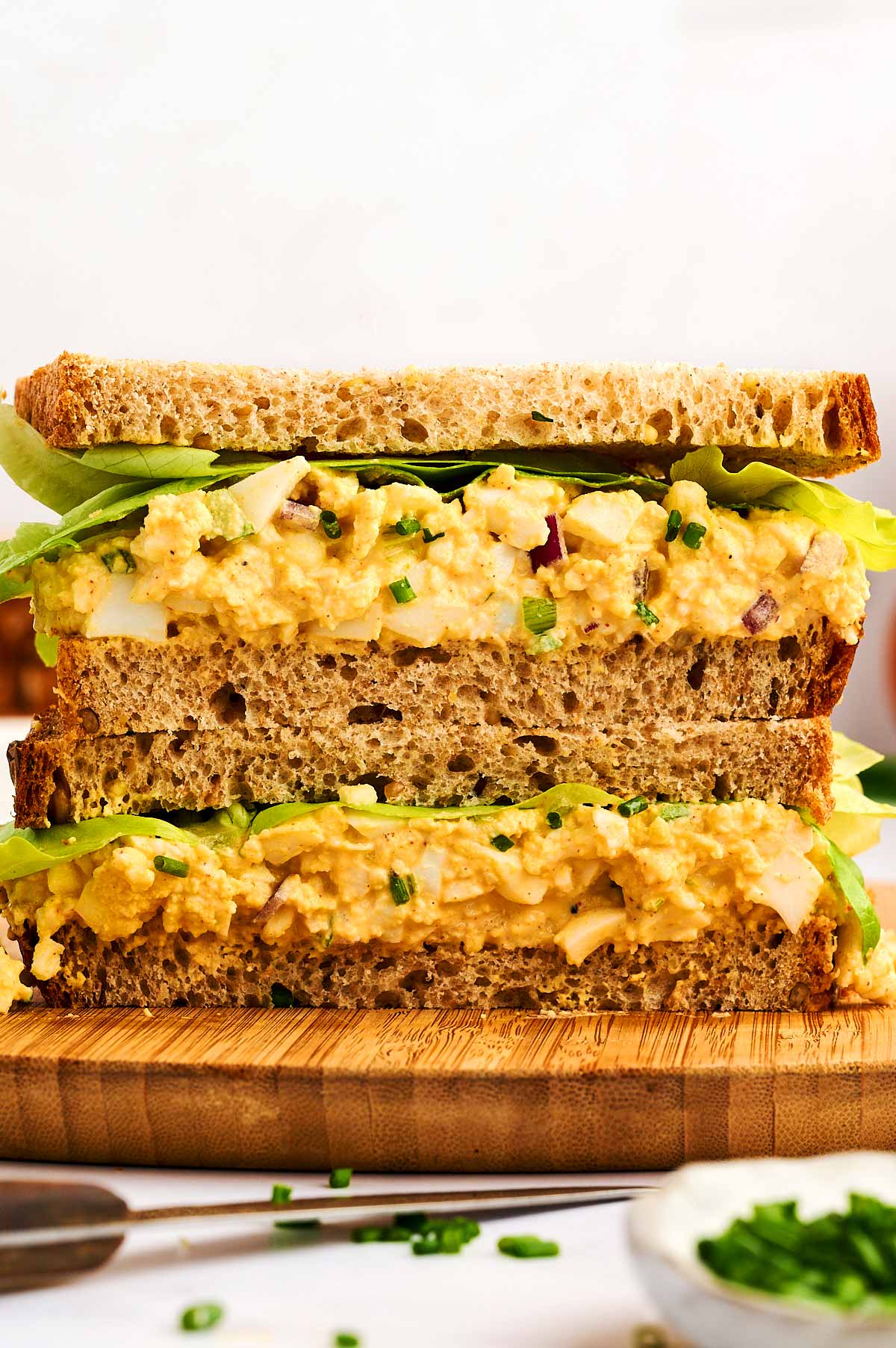Egg salad sandwiches stacked.