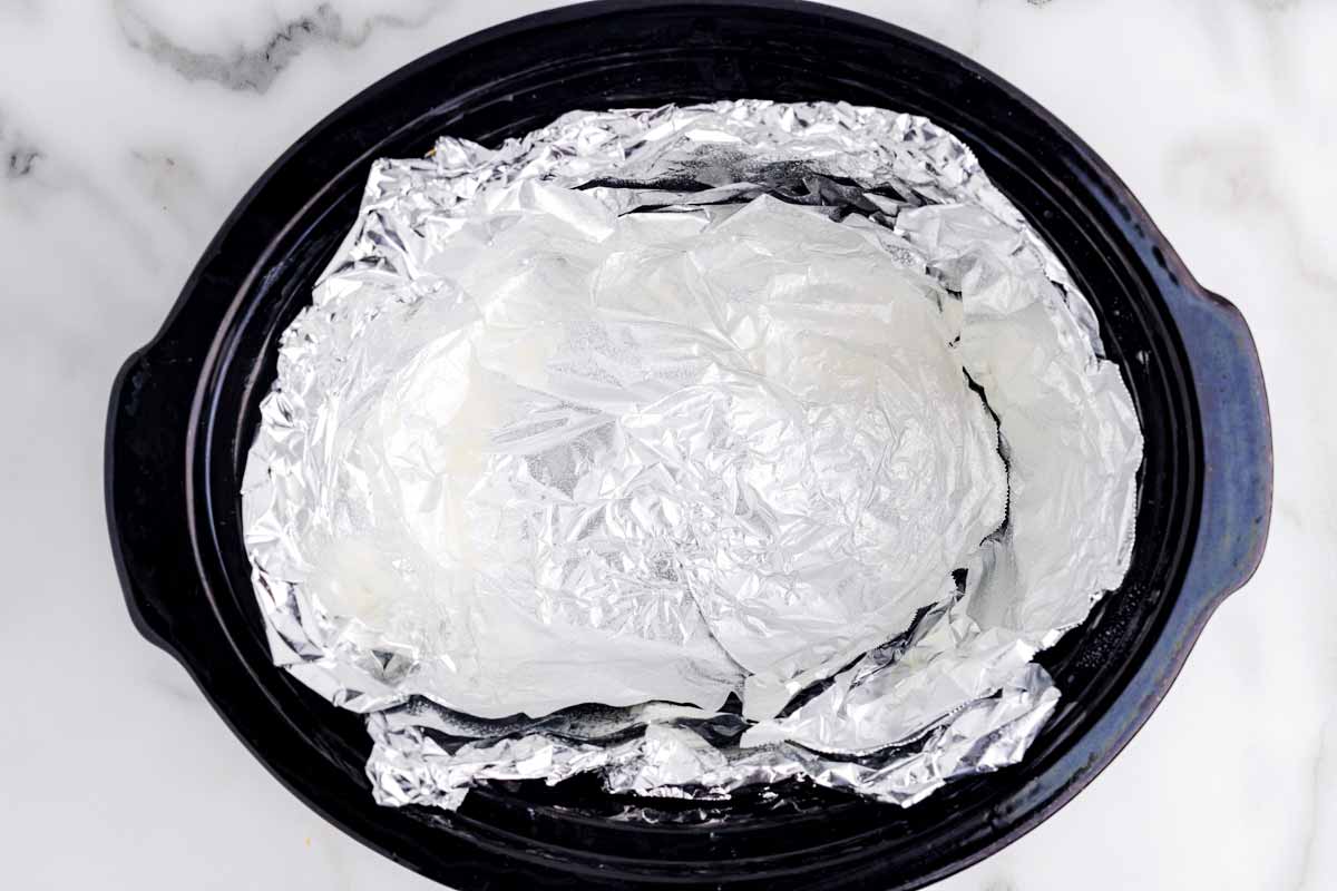 Foil sling inside crockpot.